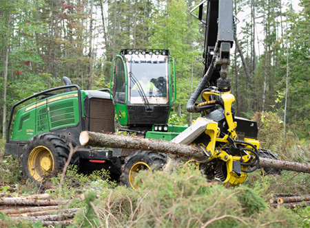 Wheeled Harvester with cab rotated for full visual of harvesting head