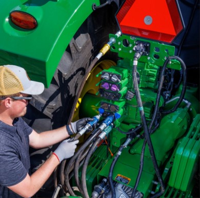 Color-coded hoses plugging into tractor SCV