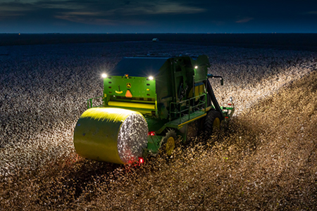 CP770 harvesting cotton at night