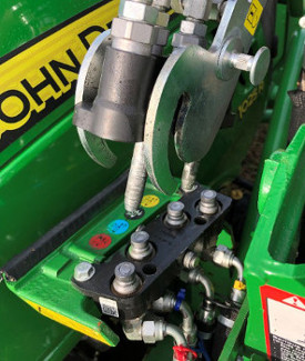 Align the loader side of hydraulic system with the fixed tractor section