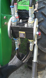 Raccord hydraulique à point unique (fermé) sur un tracteur utilitaire