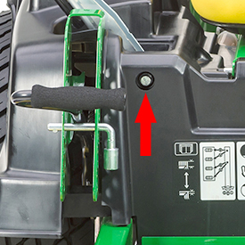 Cut-height pin doubles as tool for tracking adjustment (arrow)