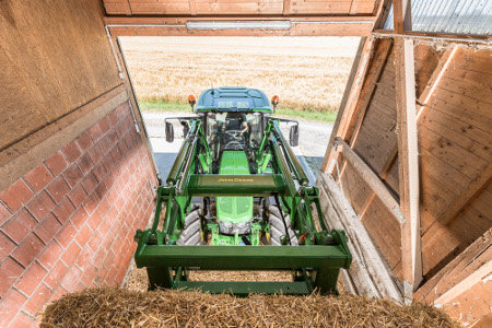 Slim boom, panorama roof, and low engine hood for perfect combination for visibility from John Deere