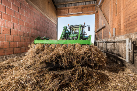 Sticky manure and full grapples of silage are easily handled with the M-Series Loader
