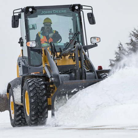 Loader with snow blade