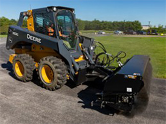 Large frame skid steer equipped with a broom