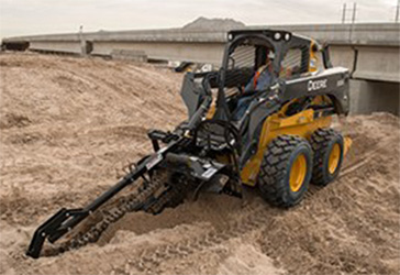 Large frame skid steer equipped with a trencher