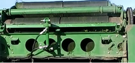 Hydraulic belts scrapper installed on baler