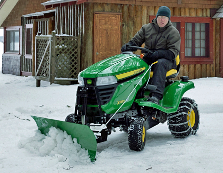 44-in. (112-cm) Front Blade removing snow (shown with optional angling and electric lift)