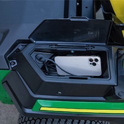 Covered storage compartment charging a cell phone
