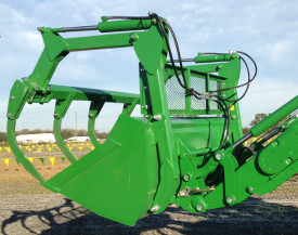 Five-tine bale grapple with screen installed on 85–in. (2150 mm) bucket on H-Series Loader