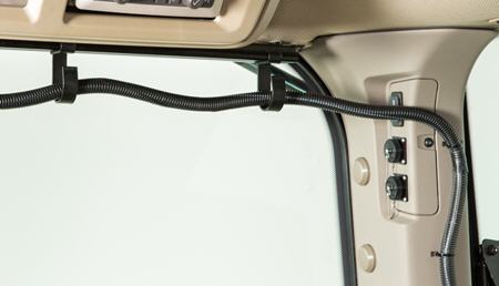 R562310 harness routing hook (shown mounted to headliner rail R558980 and using retention features of the C-post)