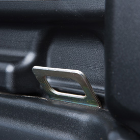 Integrated tie-down point in cargo box bed