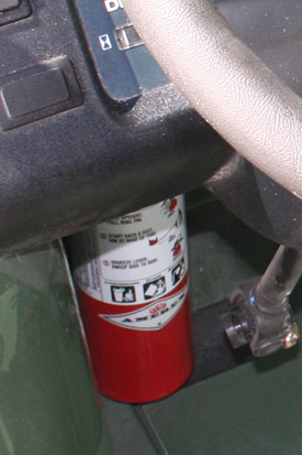 Fire extinguisher - located under dash (left side)